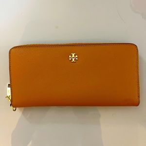 Tory Burch wallet 8 inches by 4 inches.
